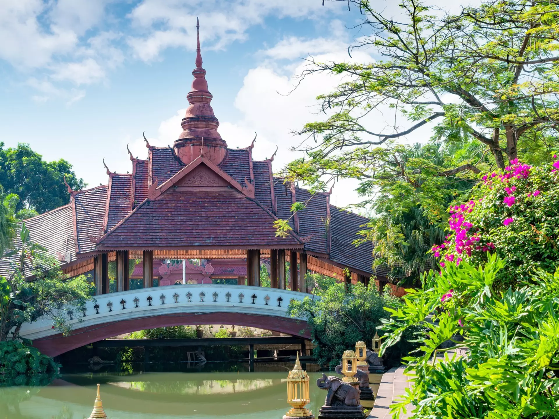 Dai architecture in Xishuangbanna's gardens. gyn9038/Getty Images
