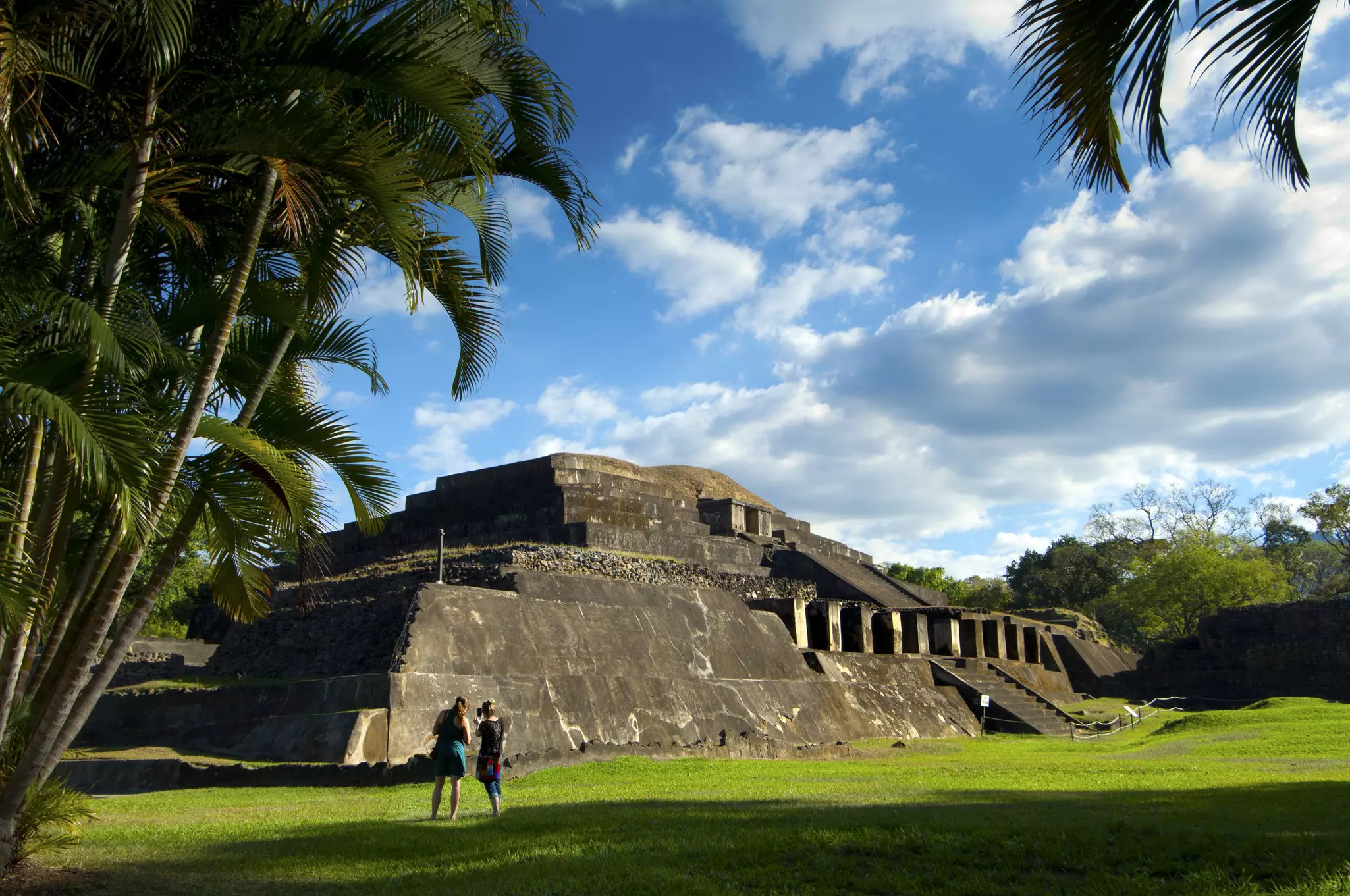 Visitors photograph step pyramid ruins