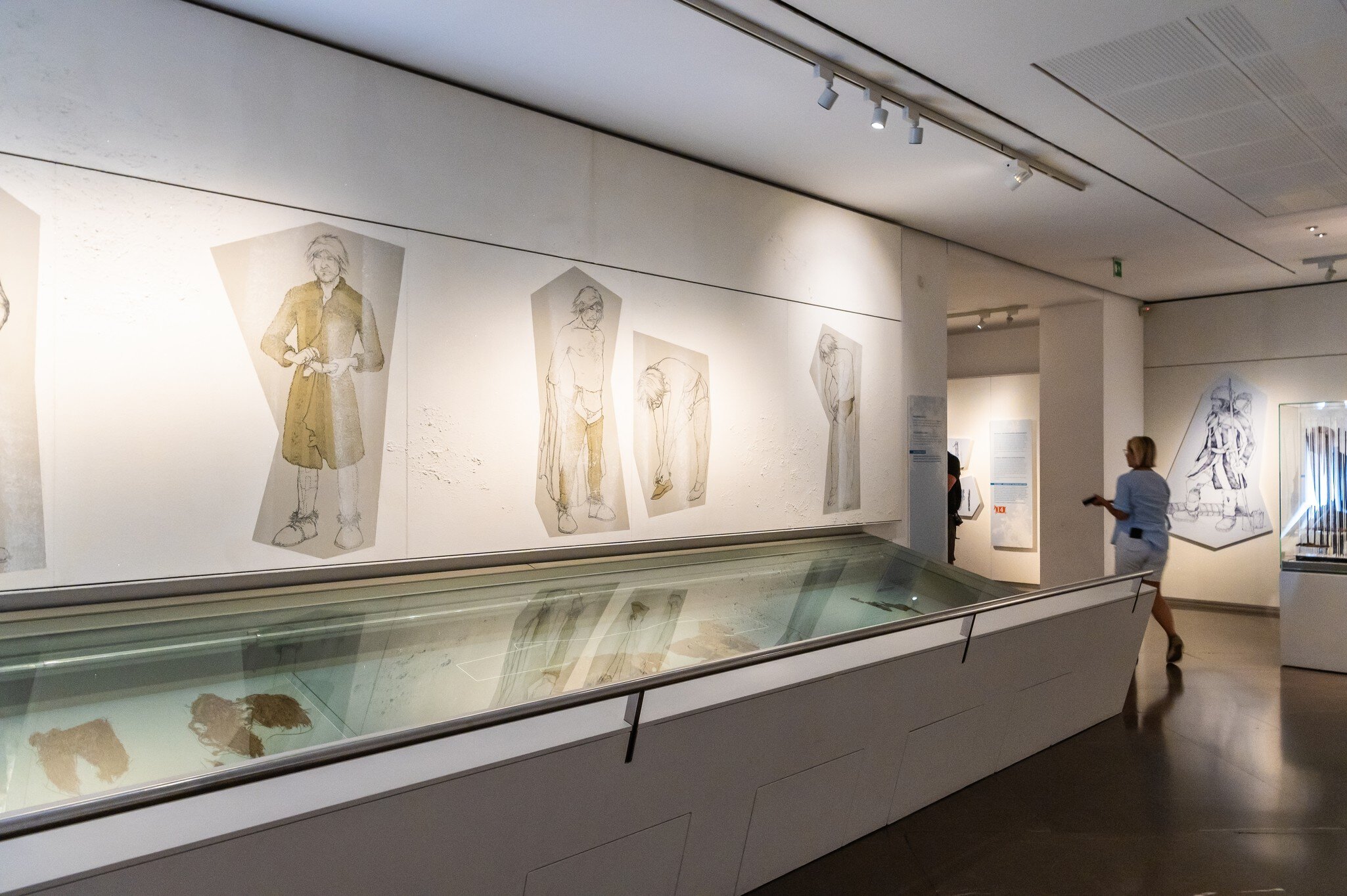 A visitor inside the South Tyrol Museum of Archaeology.