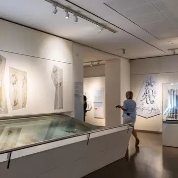 A visitor inside the South Tyrol Museum of Archaeology.