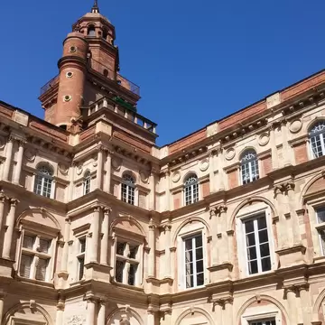 Dec, 2018: Interior facade of the Renaissance-style mansion Hôtel d'Assézat, with its brick tower.