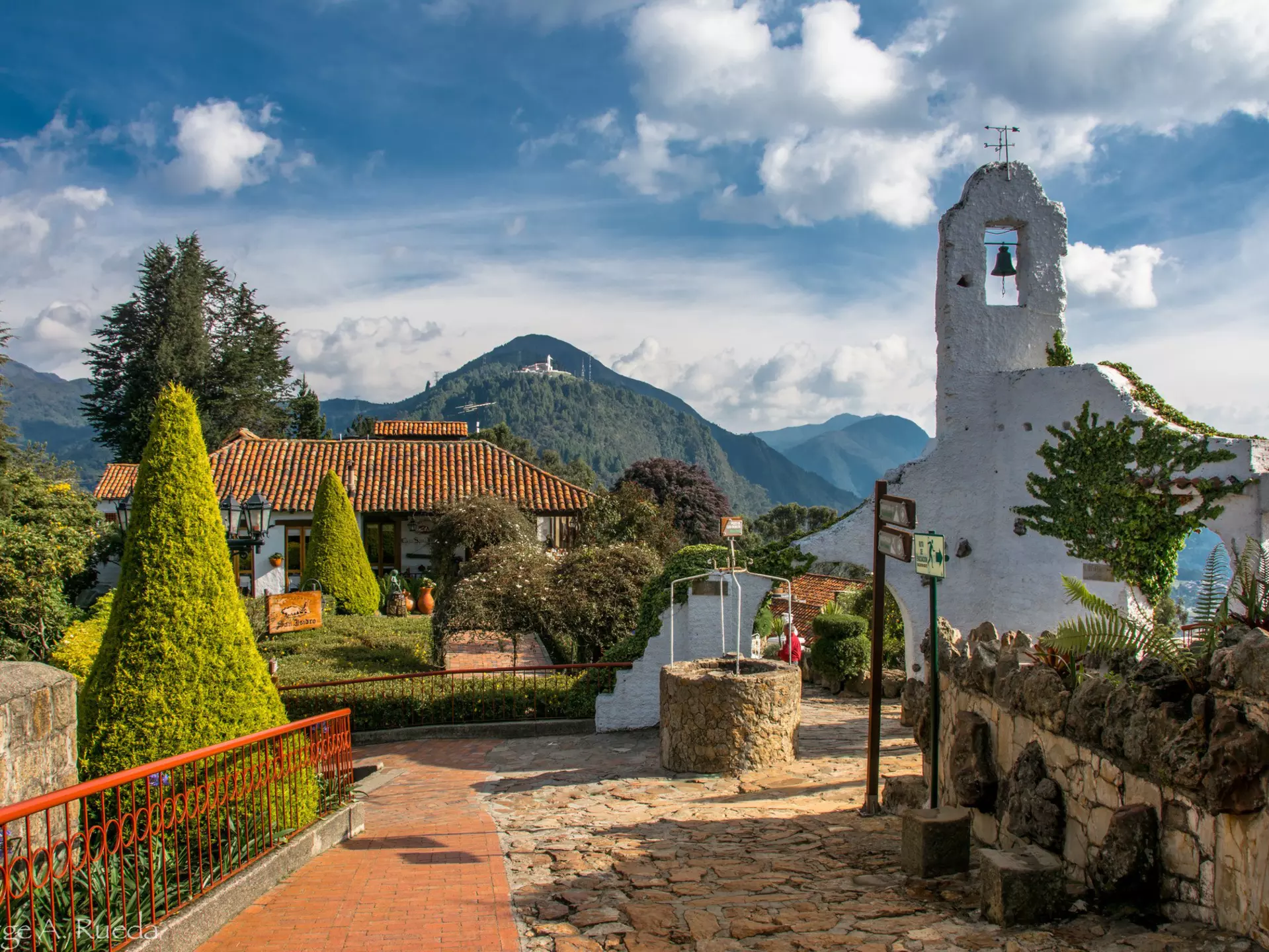 Monserrate and a 17th century church in Bogota, Colombia
Licensing ID: 3290549, Photo ID: 65225595
Bogota, Colombia, South America, Latin America, Monserrate, Outdoors, Daytime, City, Urban Scene, Mountain, Nature, Natural World, Street, Church, Place Of Worship, 17th Century, Bell Tower, Tower, Topiary, Landscape Architecture, Plants, Ornamental Garden, Clouds, Sky, Railing, Nobody, Travel, Travel Destinations