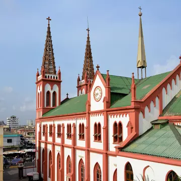 Lomé, Togo: Catholic Cathedral of the Sacred Heart, built by the Germans in 1901 - Gothic revival style with lattice work steeples - view towards Rue de l'Eglise - Cathédrale du Sacré-Cœur de Lomé / Herz-Jesu-Kathedralkirche
