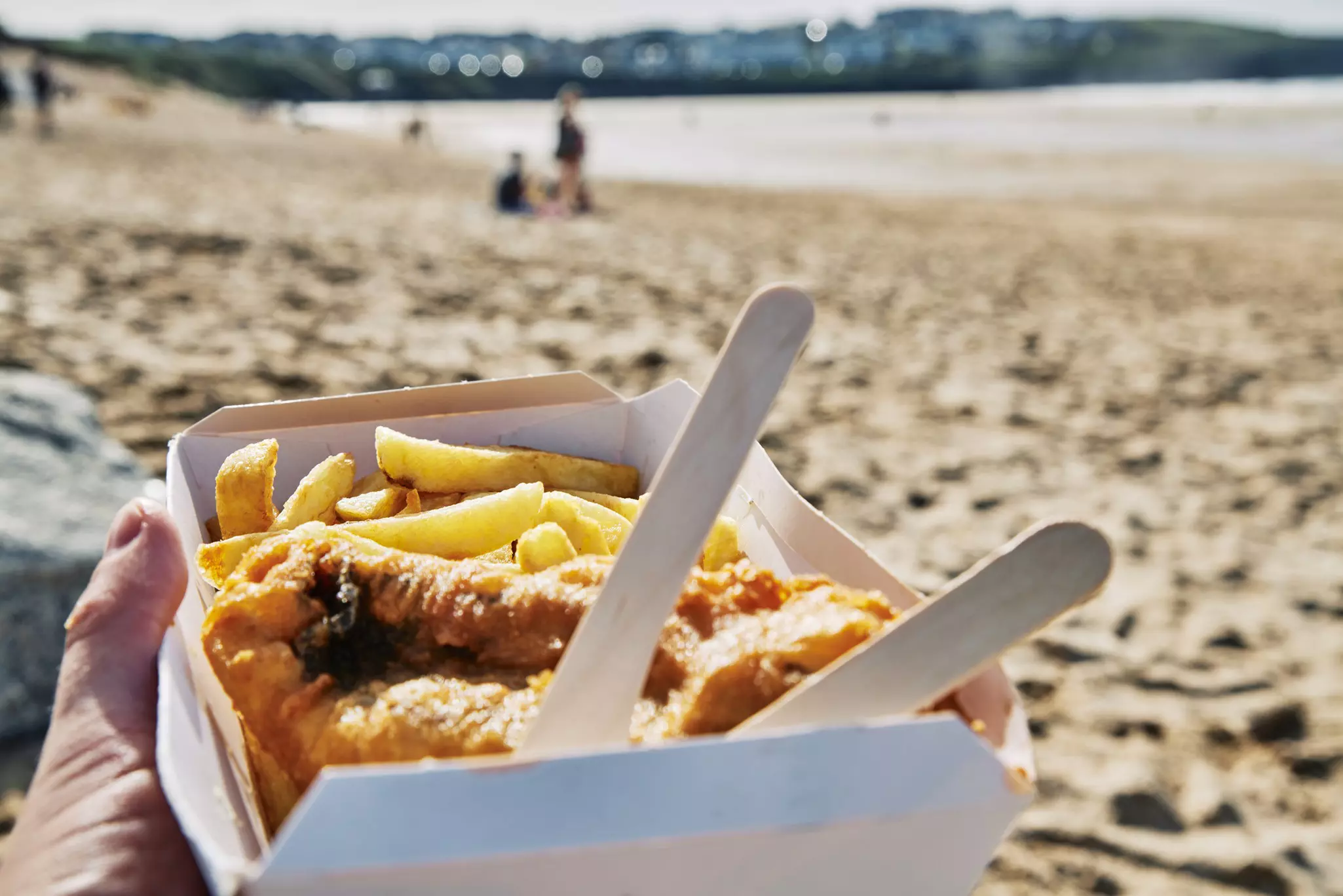 Expect to pay around £10 for a takeout portion of fish and chips © creacart / Getty Images