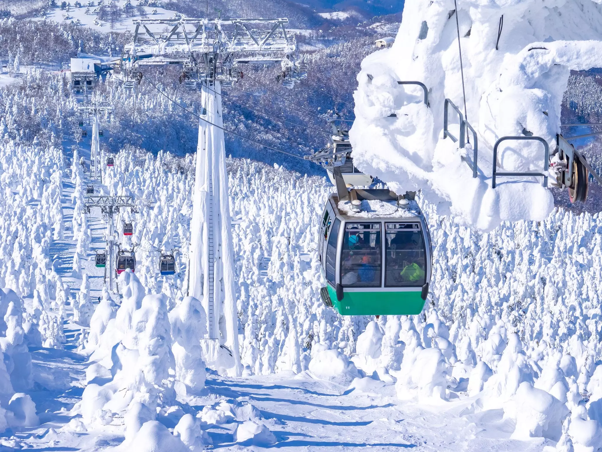 A cable car passes through icy scenery at Yamagata in Japan. 
