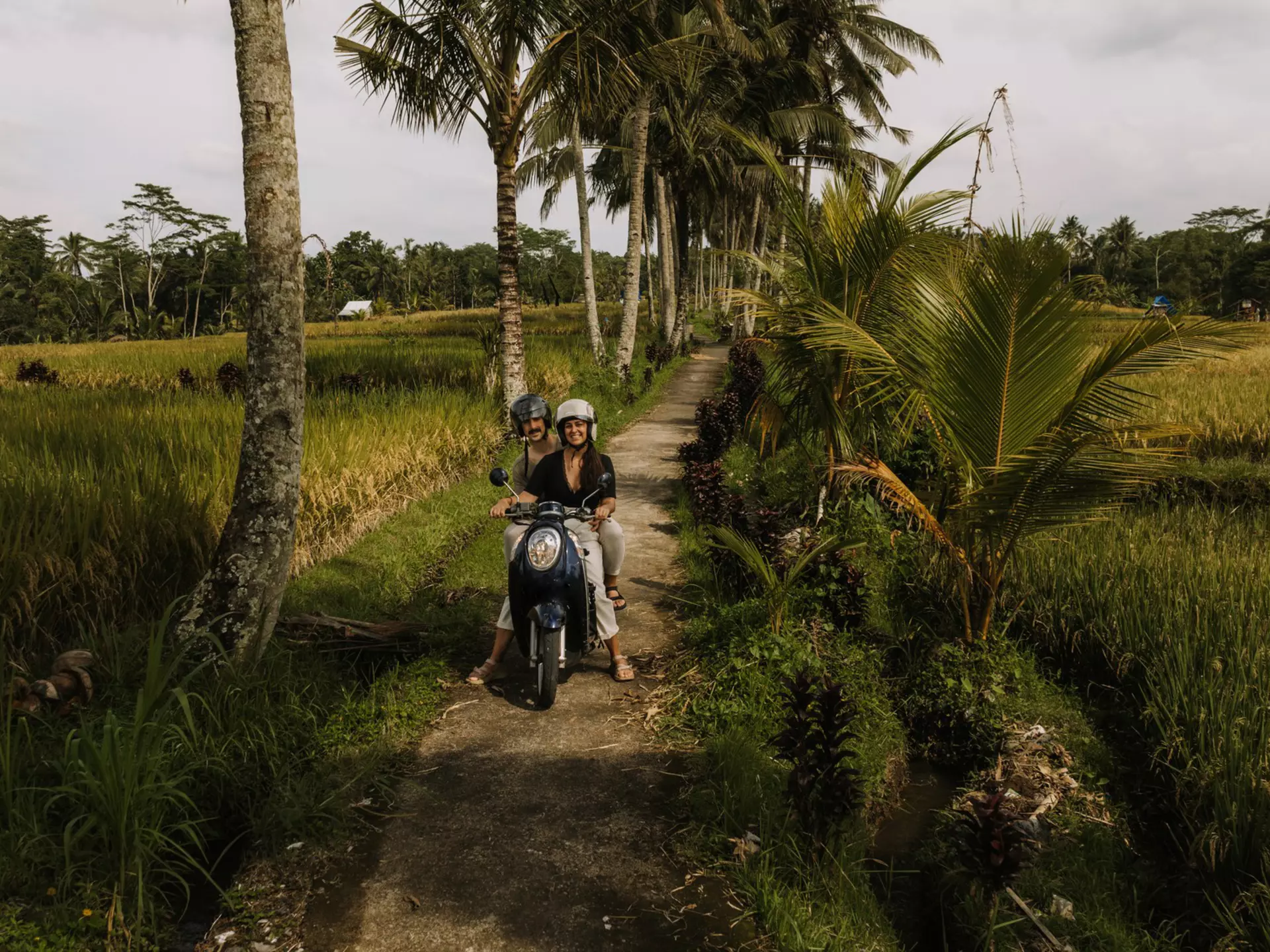 Traveling by scooter in Bali. Raquel Arocena Torres/Getty Images