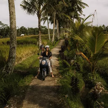 Traveling by scooter in Bali. Raquel Arocena Torres/Getty Images