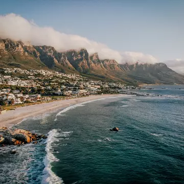 Beach and Twelve Apostles mountain in Camps Bay near Cape Town in South Africa.