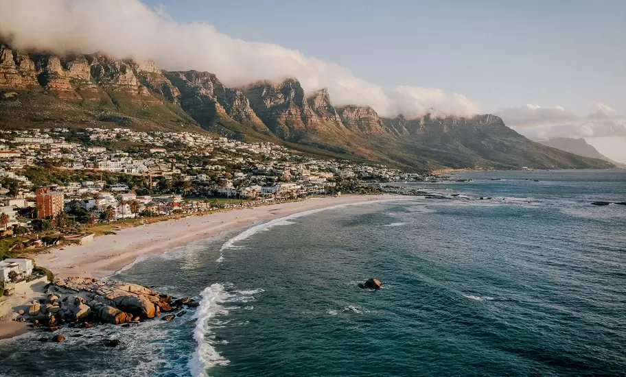 Beach and Twelve Apostles mountain in Camps Bay near Cape Town in South Africa.