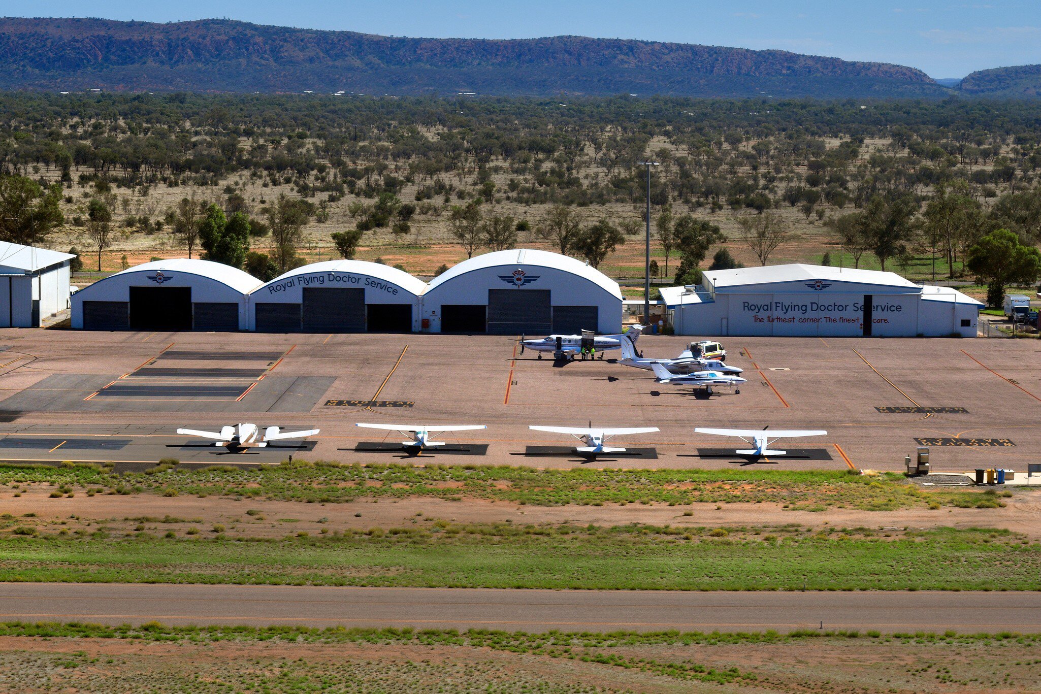 Aircrafts and buildings on Alice Springs airport, base of Royal Flying Doctor Service, in Alice Springs, Australia.