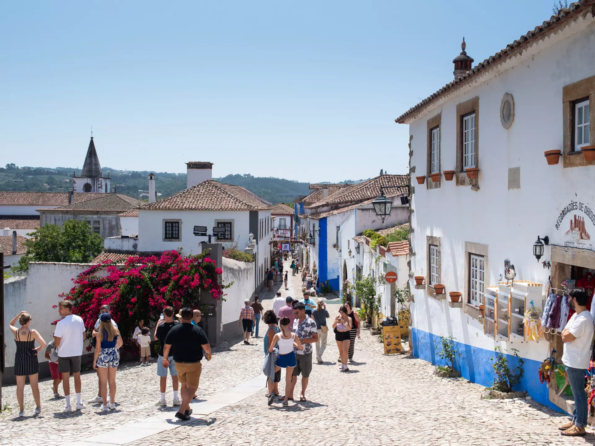 People on a main shopping street of a small town.