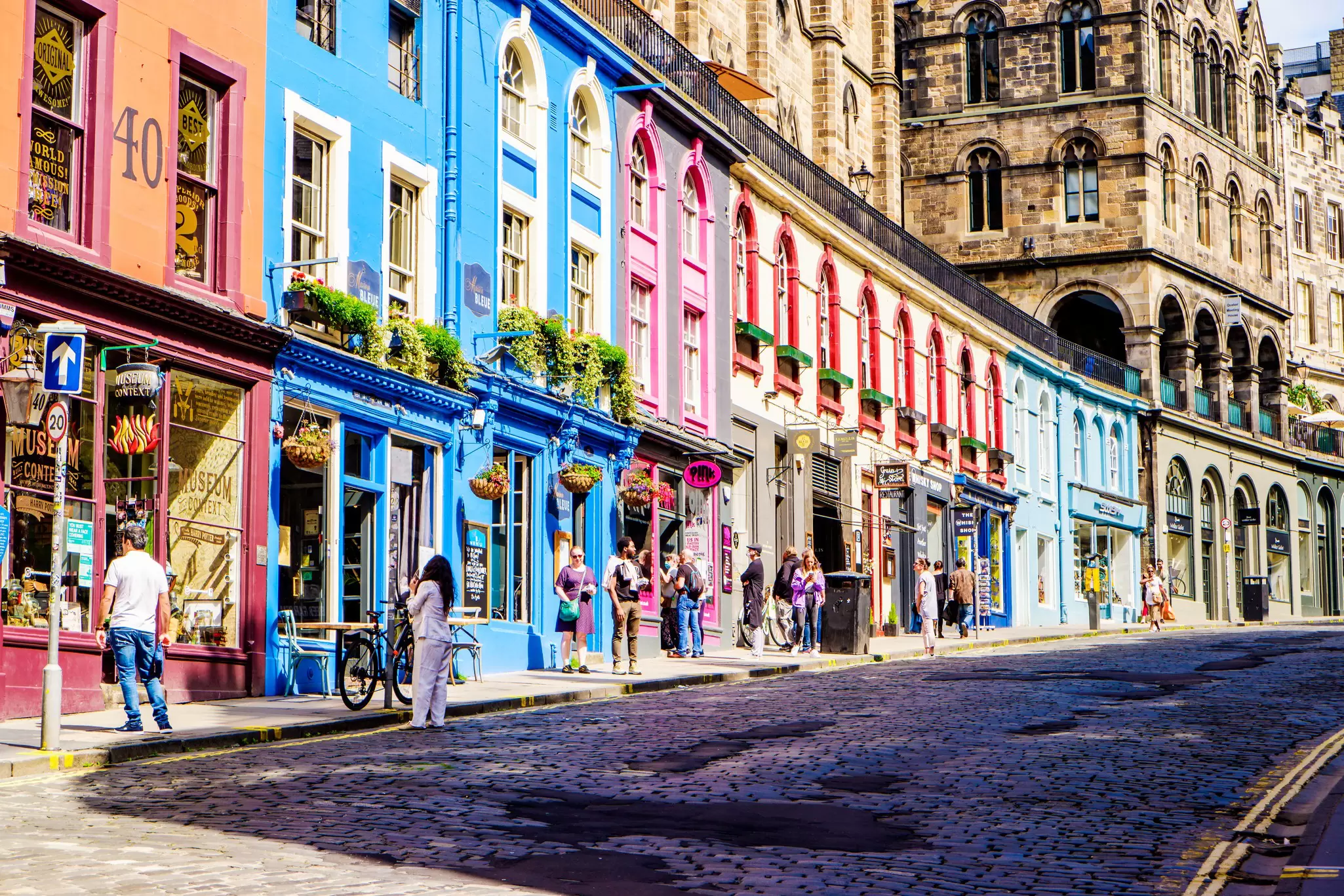 Colorful shopfronts on Victoria St in Edinburgh's Old Town. 