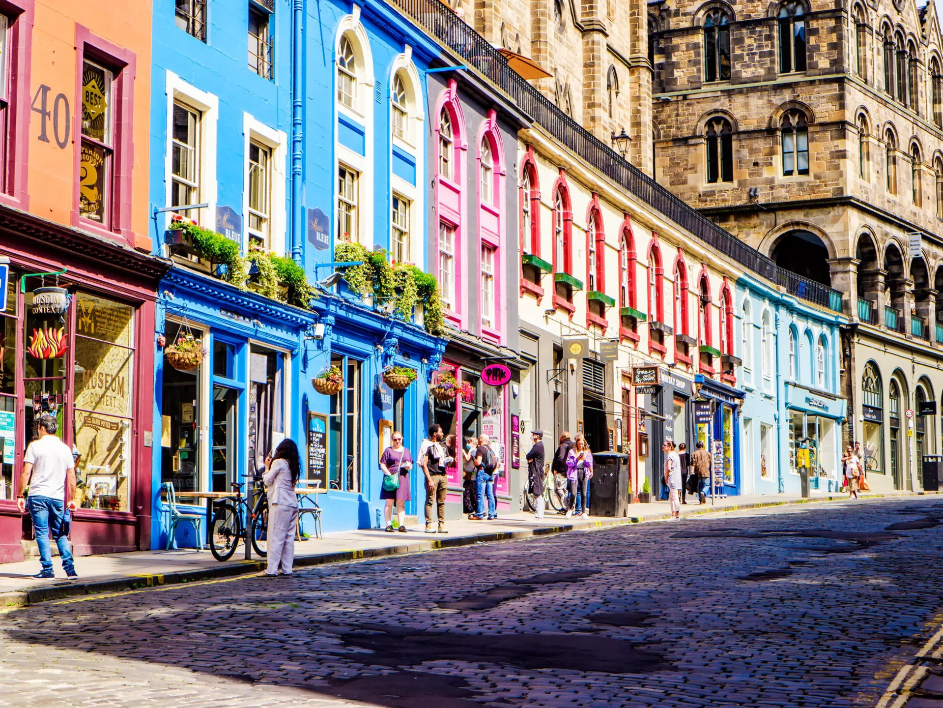 Colorful shopfronts on Victoria St in Edinburgh's Old Town. 