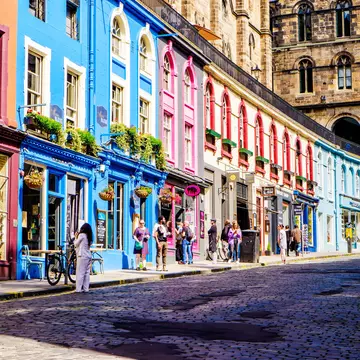 Colorful shopfronts on Victoria St in Edinburgh's Old Town. 