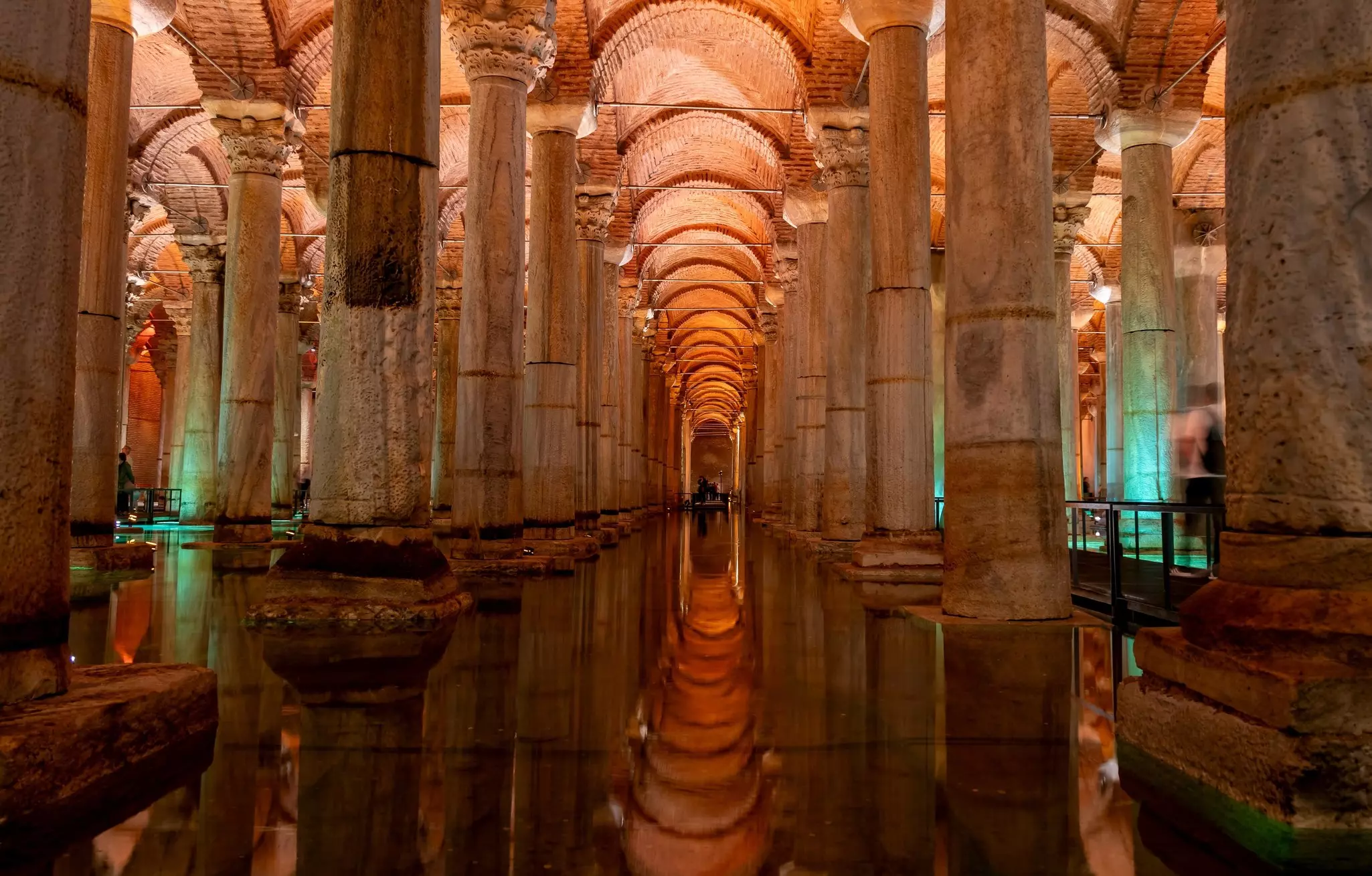 A vaulted room flooded with water is filled with columns.
