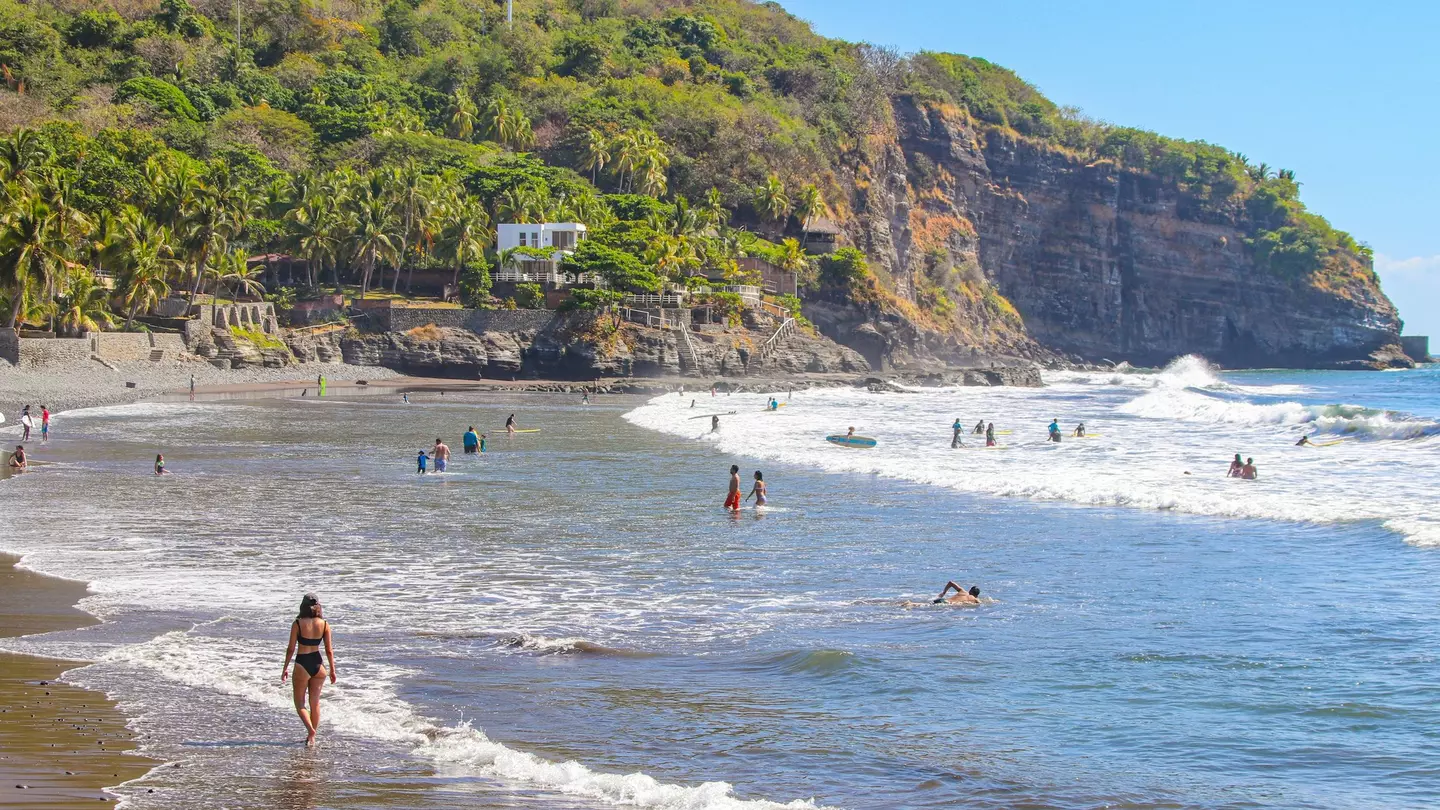 People enjoying the beach in El Tunco, El Salvador.