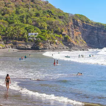 People enjoying the beach in El Tunco, El Salvador.