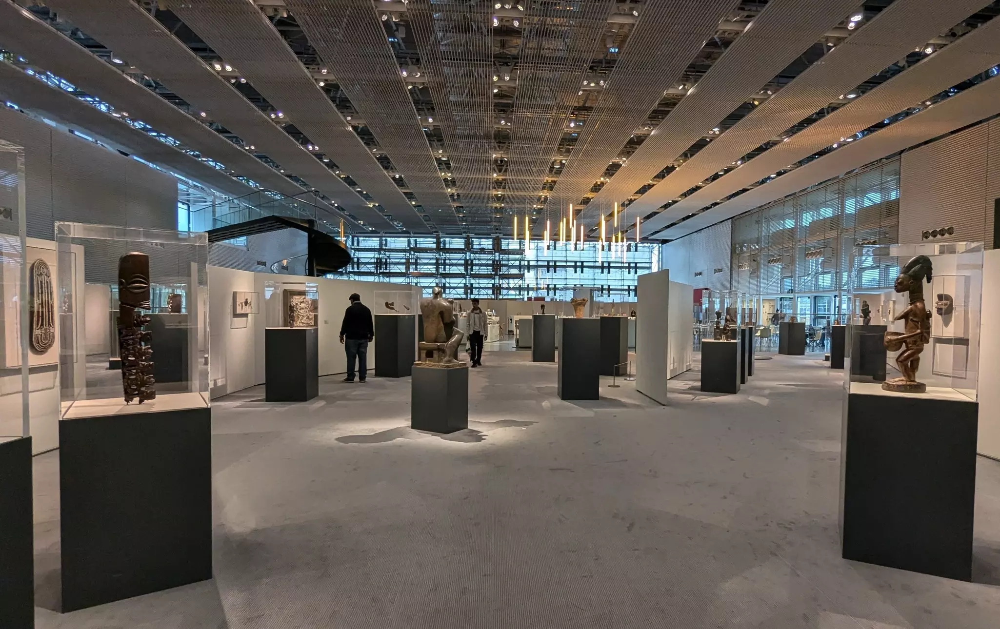 Visitors looking at exhibits in the Sainsbury Centre, an art and anthropology museum on the campus of the University of East Anglia, Norwich, England.