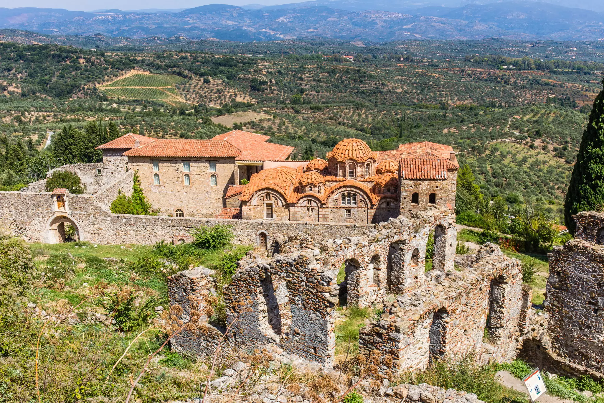 An aerial view of a partly-ruined Byzantine church in medieval city of Mystras, Greece.