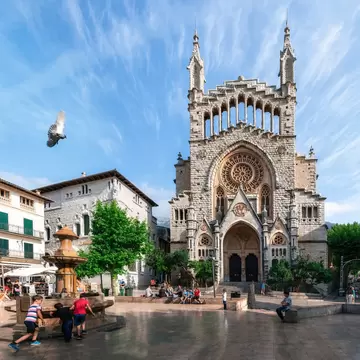 Soller, Mallorca, Spain - May 26, 2016: Panoramic view of a town center of Soller with Sant Bartomeu Church on Placa de sa Constitucio, Majorca.