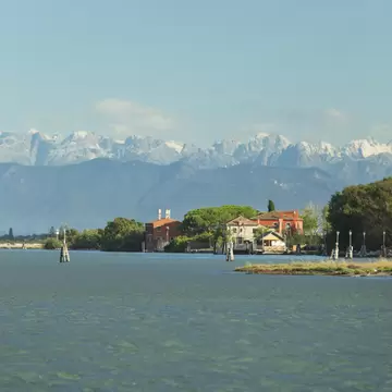 View of Torcello island and peaks of the Dolomites.