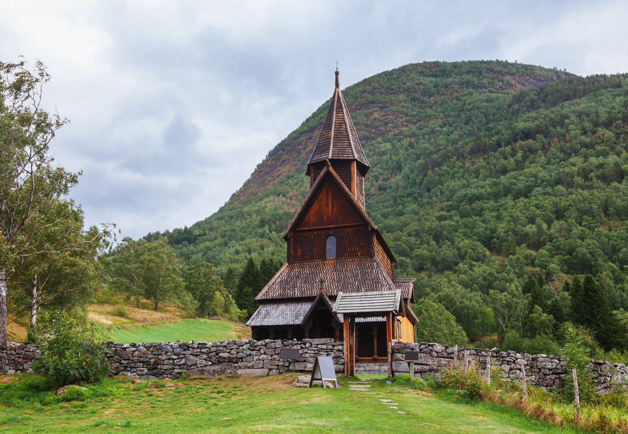 12th century wooden Romanesque Urnes Stave Church (Urnes stavkyrkje), listed as UNESCO World Heritage Site and one of the oldest stave churches in Norway. Ornes, Luster, Sogn og Fjordane county; Shutterstock ID 1290357376;