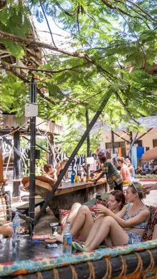 People sitting outside in a communal space chatting