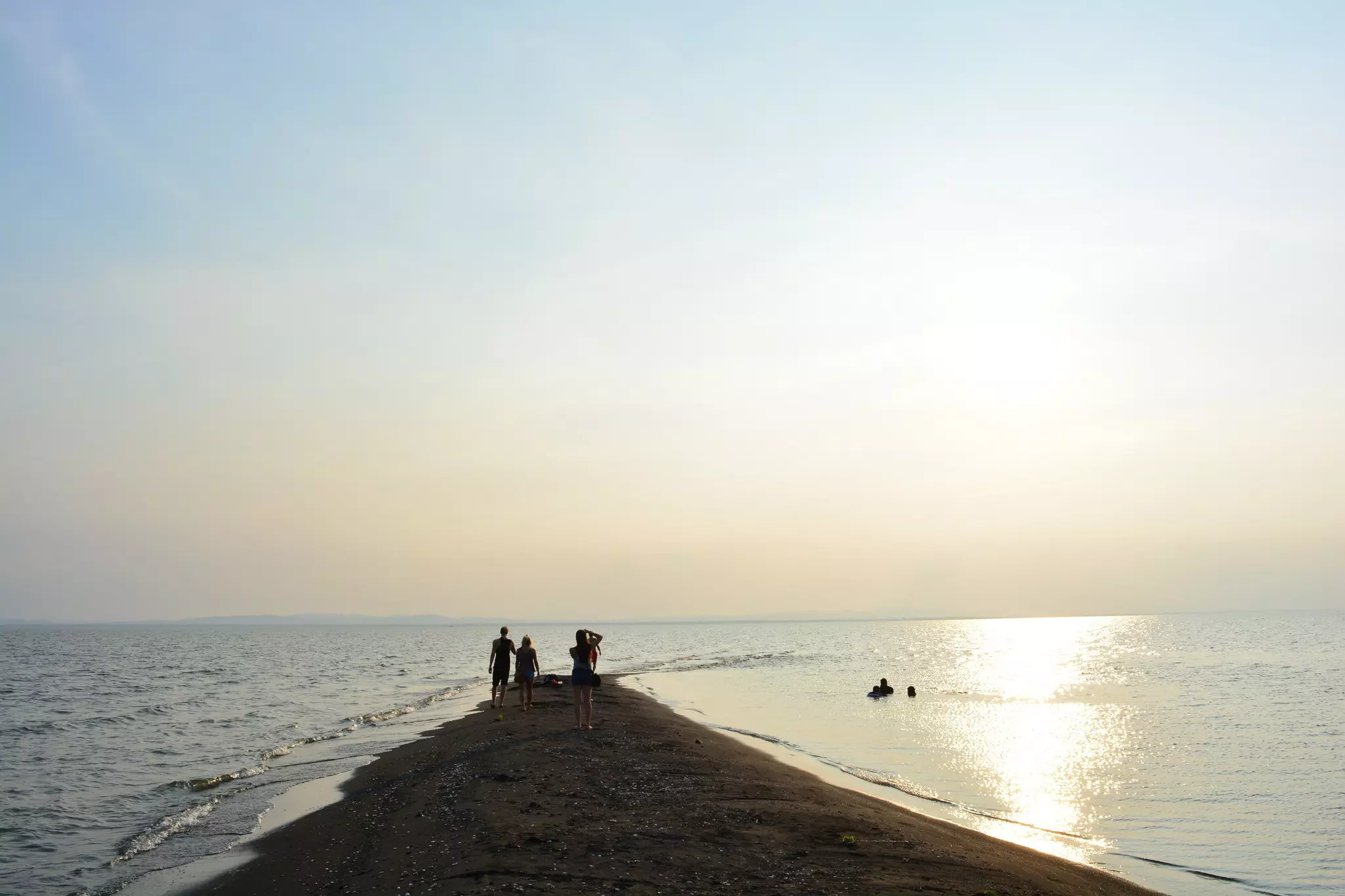 Unidentified people watching the sunset in Punta Jesus Maria beach, in Ometepe Island, Nicaragua