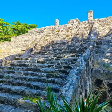 View of steps leading up to the Mayan Temple at the San Miguelito archaeological site in Cancún, Mexico.