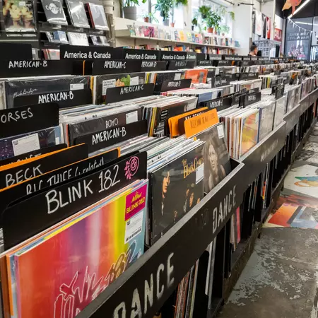 London. UK- 07.12.2020: a large shop on Brick Lane specialising in vinyl records on long play and singles, books and cassette tapes, all outdated forms of music recordings and materials.  License Type: media  Download Time: 2023-11-20T22:03:46.000Z  User: Eointloughney87  Is Editorial: Yes  purchase_order:   