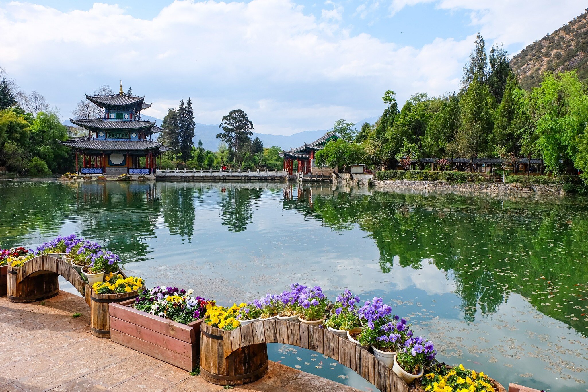 Chinese Traditional Pagoda, Pavilion and Arch Bridge at the Black Dragon Pool Park, Lijiang Old Town , License Type: media, Download Time: 2026-09-02T18:45:05.000Z, User: LP_NZhan, Editorial: false, purchase_order: 65050 - Digital Destinations and Articles, job: App Content, client: Lonely Planet App, other: Nadine Zhan 