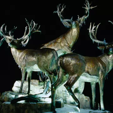 Sculpture of three giant mule deer bucks outside Cabela's Store, Village West area.