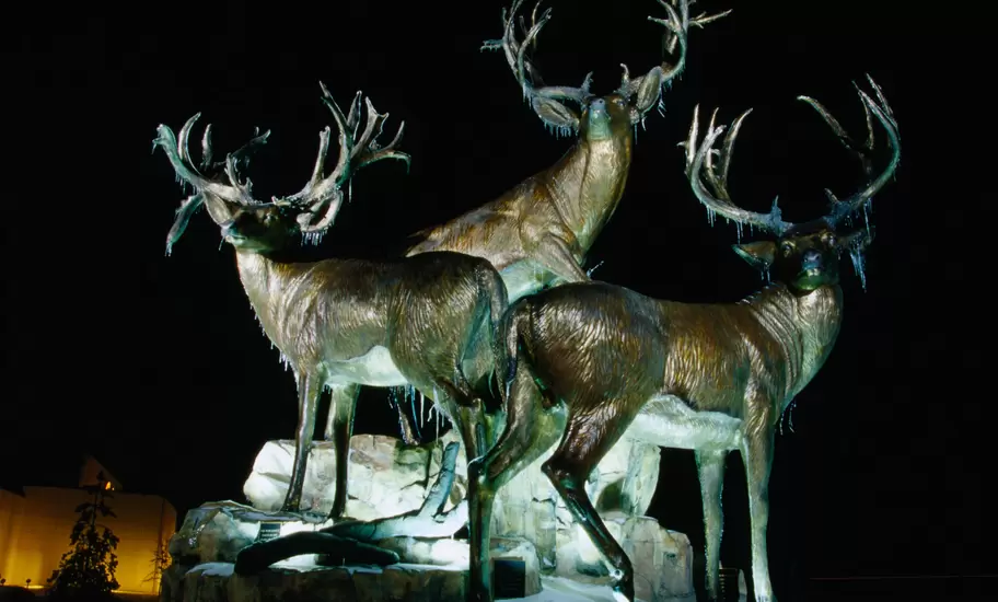 Sculpture of three giant mule deer bucks outside Cabela's Store, Village West area.