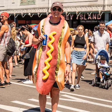 A man dressed as a hot dog Nathan's World Famous Hot Dog Eating Contest on Coney Island Boardwalk in Brooklyn