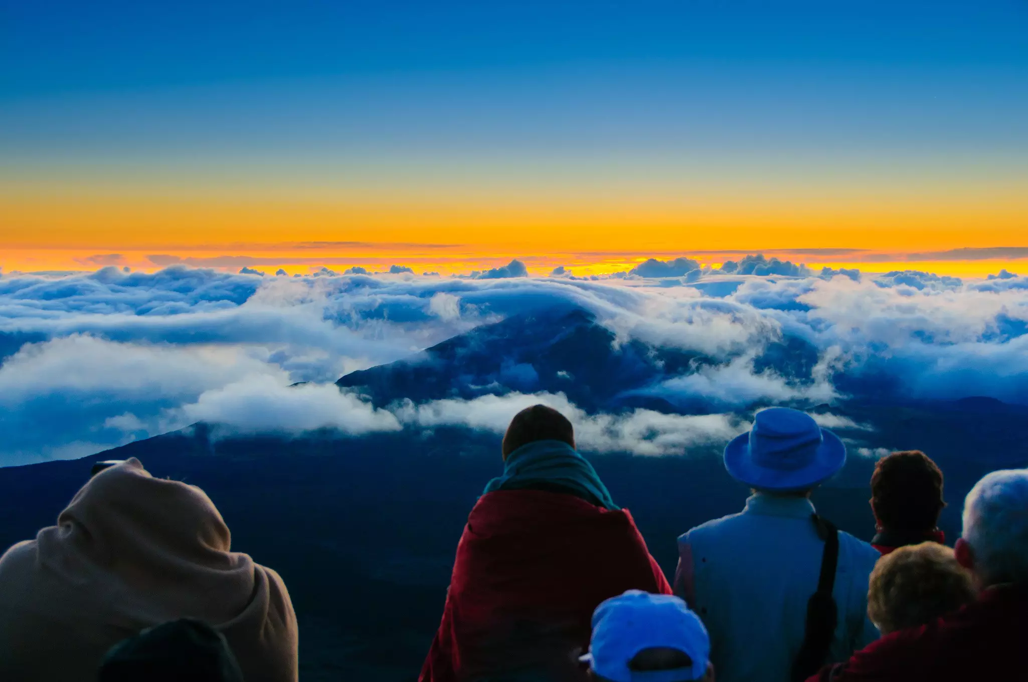 Soak up the sunrise with other early risers on the rim of the caldera in Haleakalā © DonLand / Shutterstock