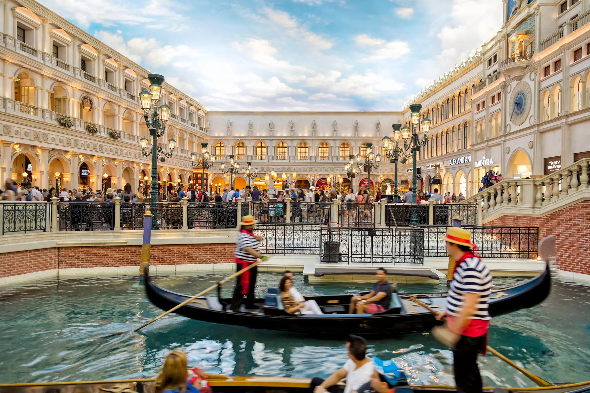 View of Grand Canal Shoppes at the Venetian Resort Hotel and Casino, gondolier and tourists on gondolas are seen in the foreground, Las Vegas, Nevada, USA
851155566