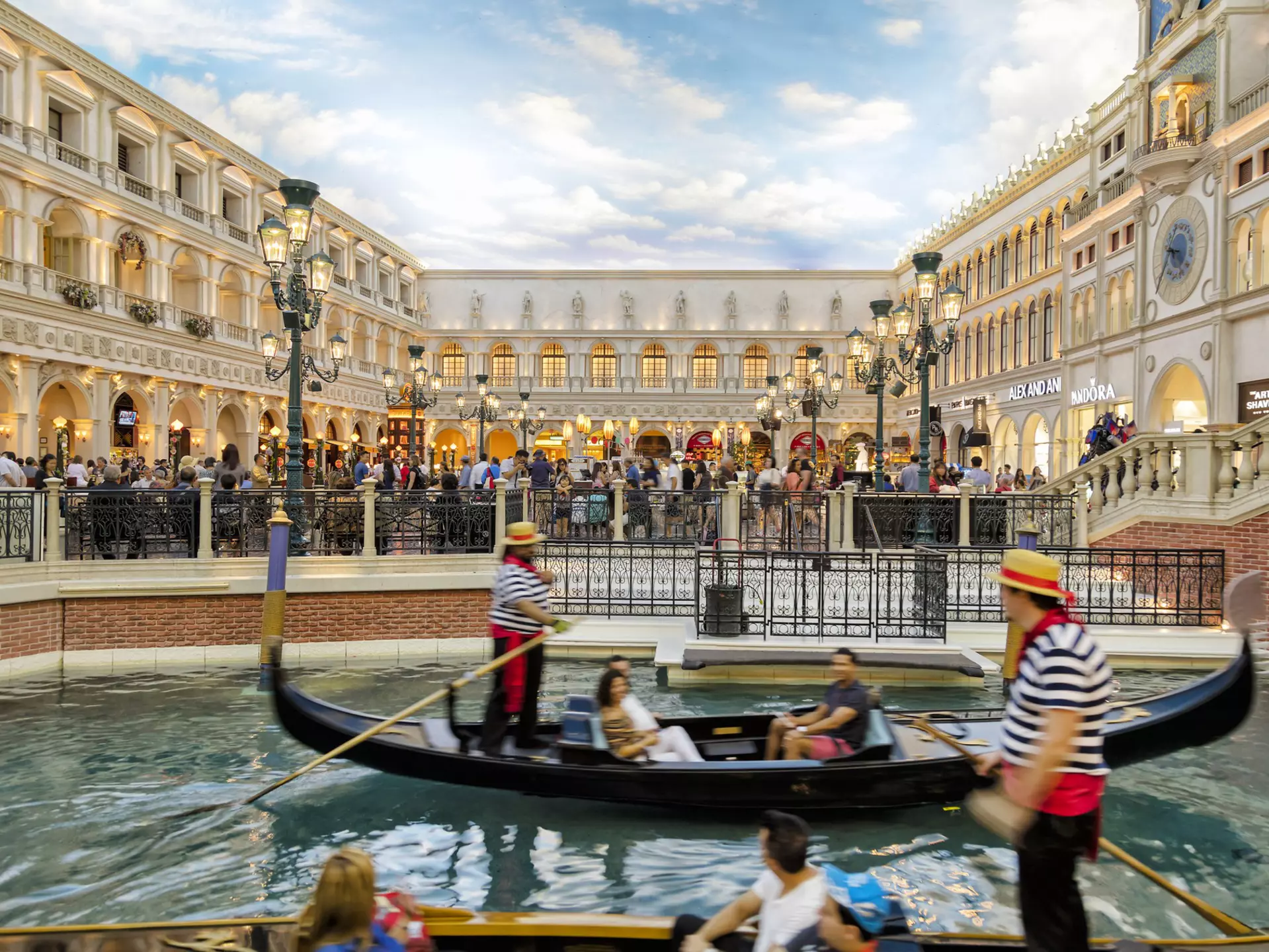 View of Grand Canal Shoppes at the Venetian Resort Hotel and Casino, gondolier and tourists on gondolas are seen in the foreground, Las Vegas, Nevada, USA
851155566
