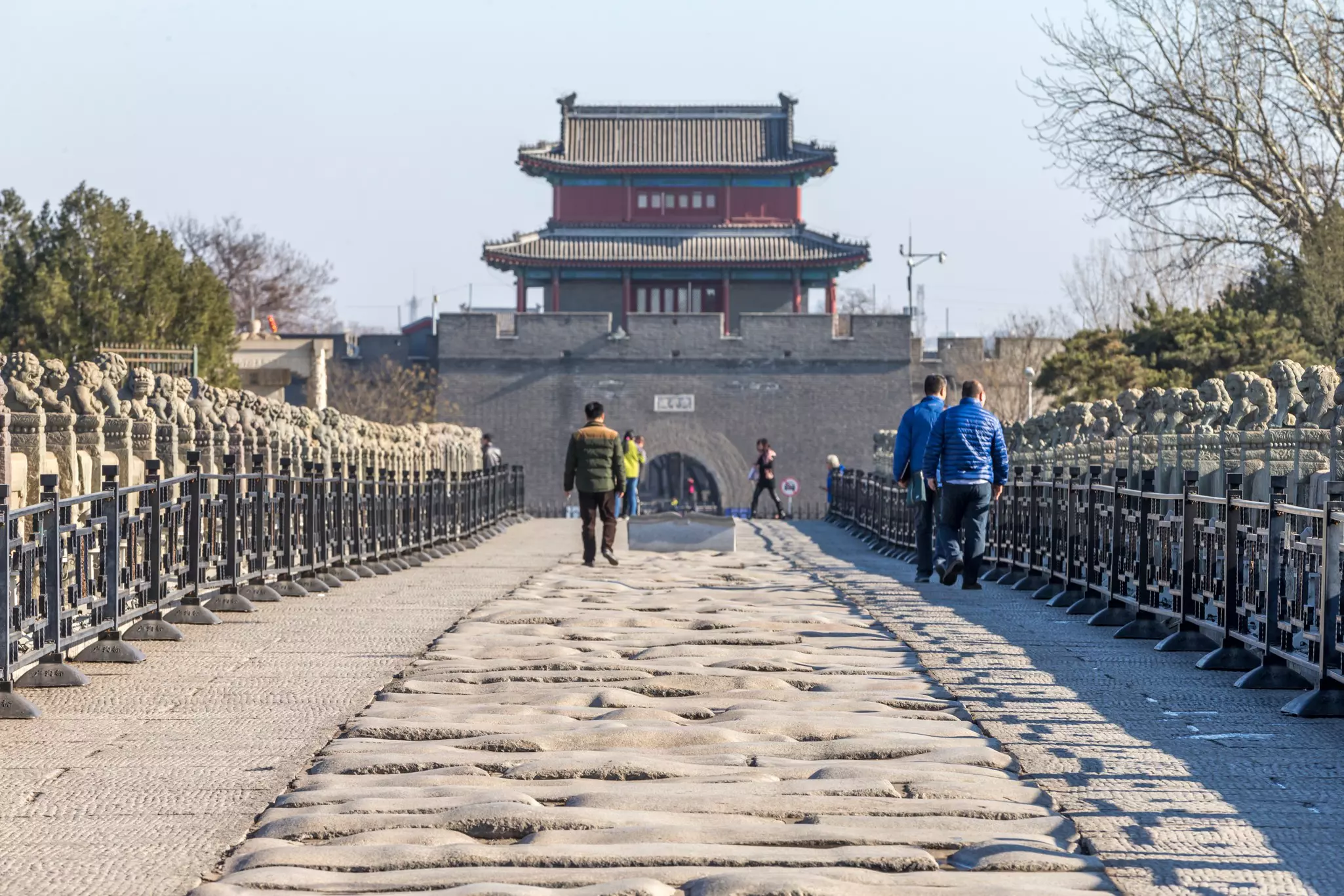People walking across Marco Polo Bridge towards Wanping Fortress. 