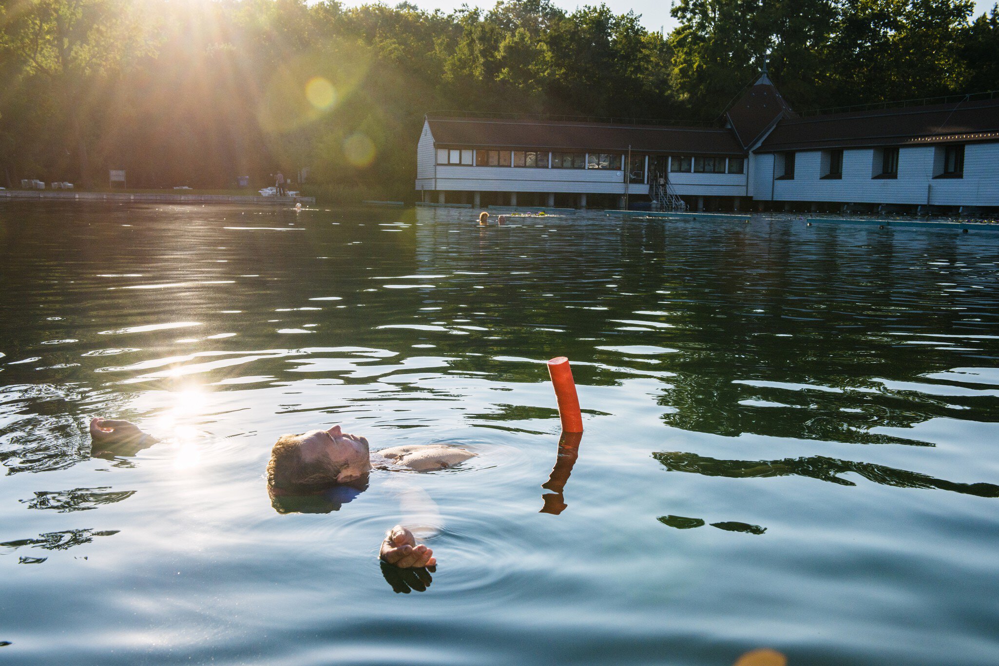 Man floating in thermal Lake Heviz.