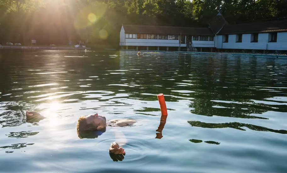 Man floating in thermal Lake Heviz.