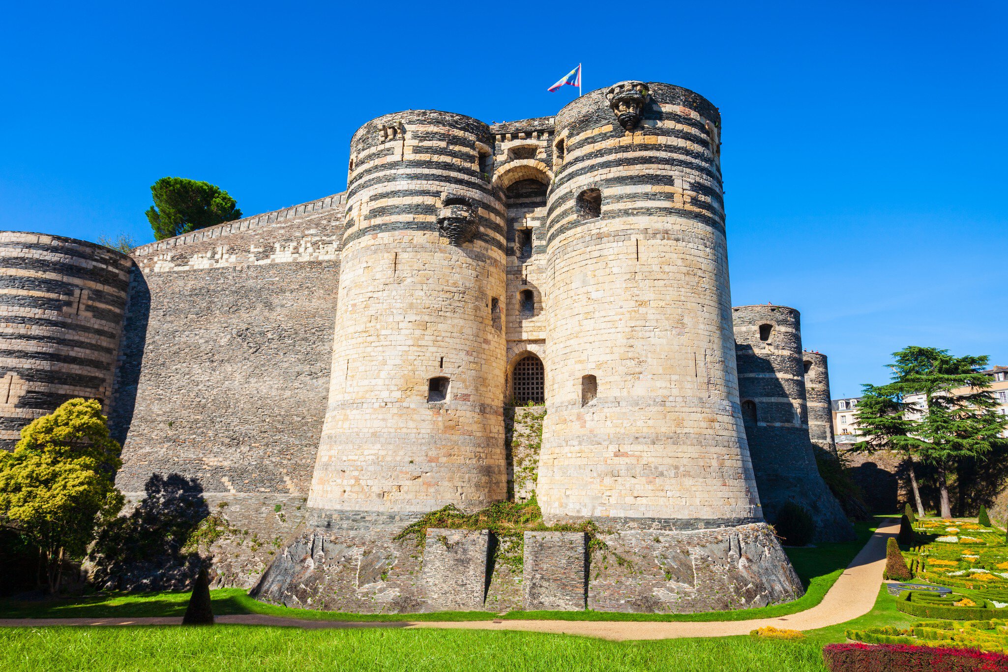 Exterior view of the Château d’Angers in the Loire Valley on a sunny day in France.