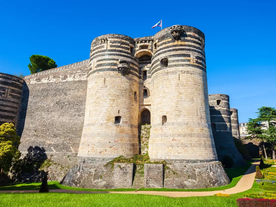 Exterior view of the Château d’Angers in the Loire Valley on a sunny day in France.