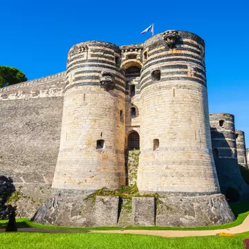 Exterior view of the Château d’Angers in the Loire Valley on a sunny day in France.