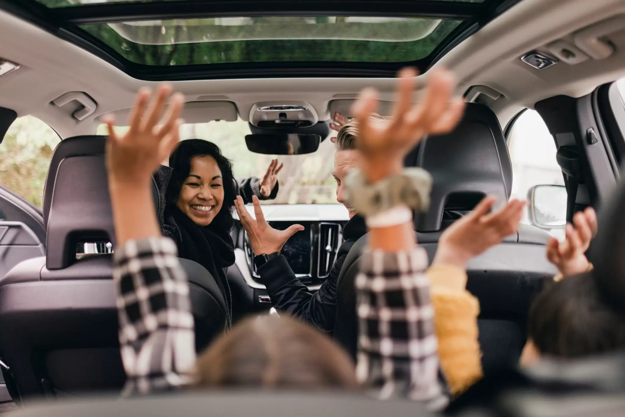 A family setting off on a road trip in Sweden