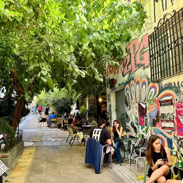 Athens, Greece - October 2, 2024 : People sitting and drinking at an outdoor cafe on Methonis pedestrian street in Exarcheia (Exarchia), Athens, Greece, License Type: media, Download Time: 2025-04-29T19:16:35.000Z, User: bhealy950, Editorial: true, purchase_order: 65050 - Digital Destinations and Articles, job: Lonely Planet Online Editorial, client: Best things to do in Athens, other: Brian Healy