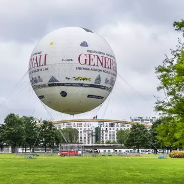 PARIS, FRANCE - MAY 20, 2019: Parc Andre Citroen (XV district) located on left bank of river Seine with a tethered hot air balloon "Air de Paris " allowing visitors to rise above the Paris skyline.; Shutterstock ID 1415932601;