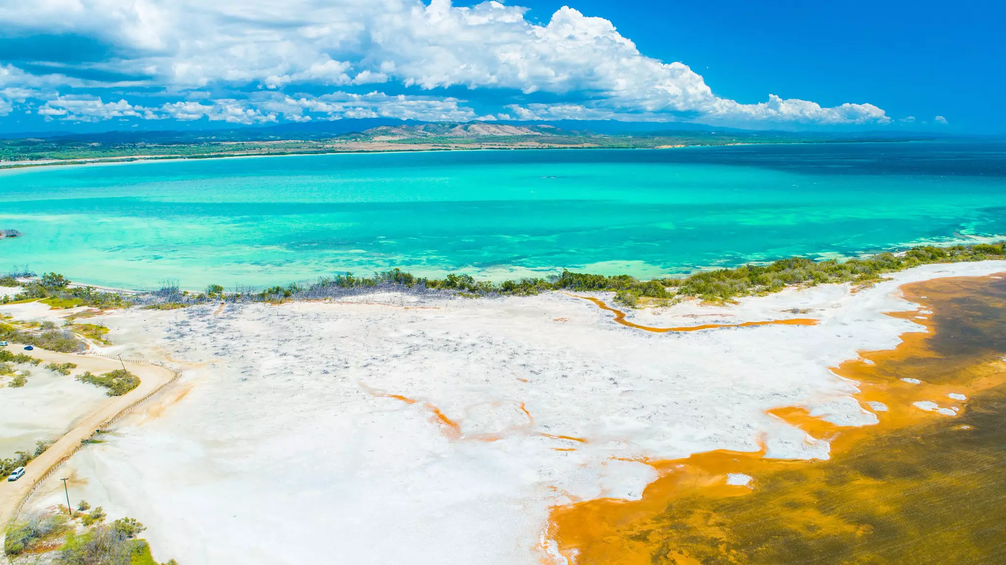Aerial view of Puerto Rico. Faro Los Morrillos de Cabo Rojo. Playa Sucia beach and Salt lakes in Punta Jaguey.