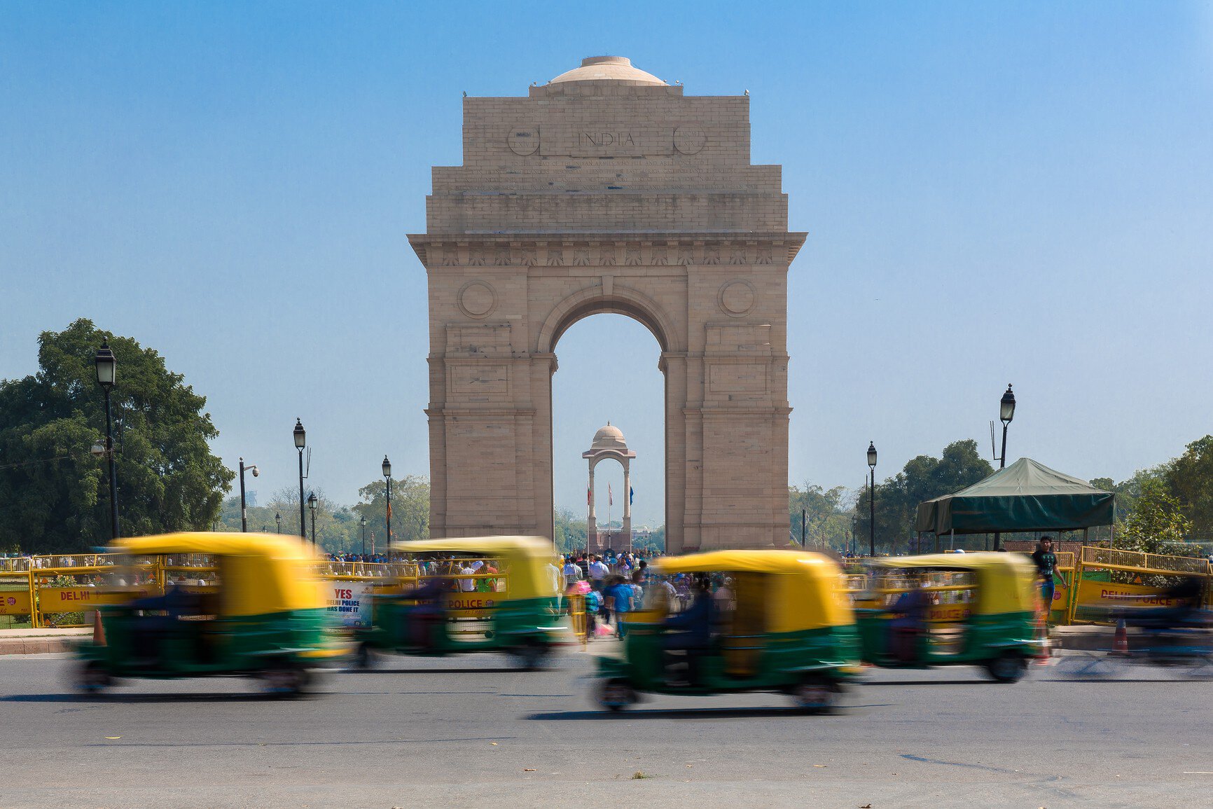 India Gate - With CNG Taxis Passing By
At the centre of New Delhi stands the 42 m high India Gate, an "Arc-de-Triomphe" like archway in the middle of a crossroad. Almost similar to its French counterpart, it commemorates the 70,000 Indian soldiers who lost their lives fighting for the British Army during the World War I. The memorial bears the names of more than 13,516 British and Indian soldiers killed in the Northwestern Frontier in the Afghan war of 1919.