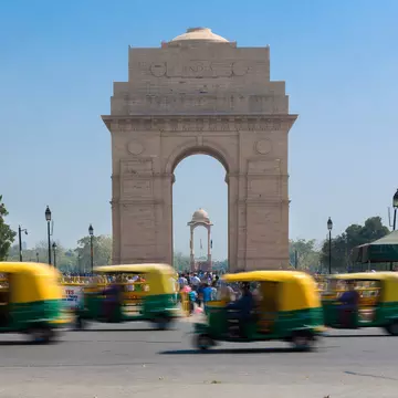India Gate - With CNG Taxis Passing By
At the centre of New Delhi stands the 42 m high India Gate, an "Arc-de-Triomphe" like archway in the middle of a crossroad. Almost similar to its French counterpart, it commemorates the 70,000 Indian soldiers who lost their lives fighting for the British Army during the World War I. The memorial bears the names of more than 13,516 British and Indian soldiers killed in the Northwestern Frontier in the Afghan war of 1919.