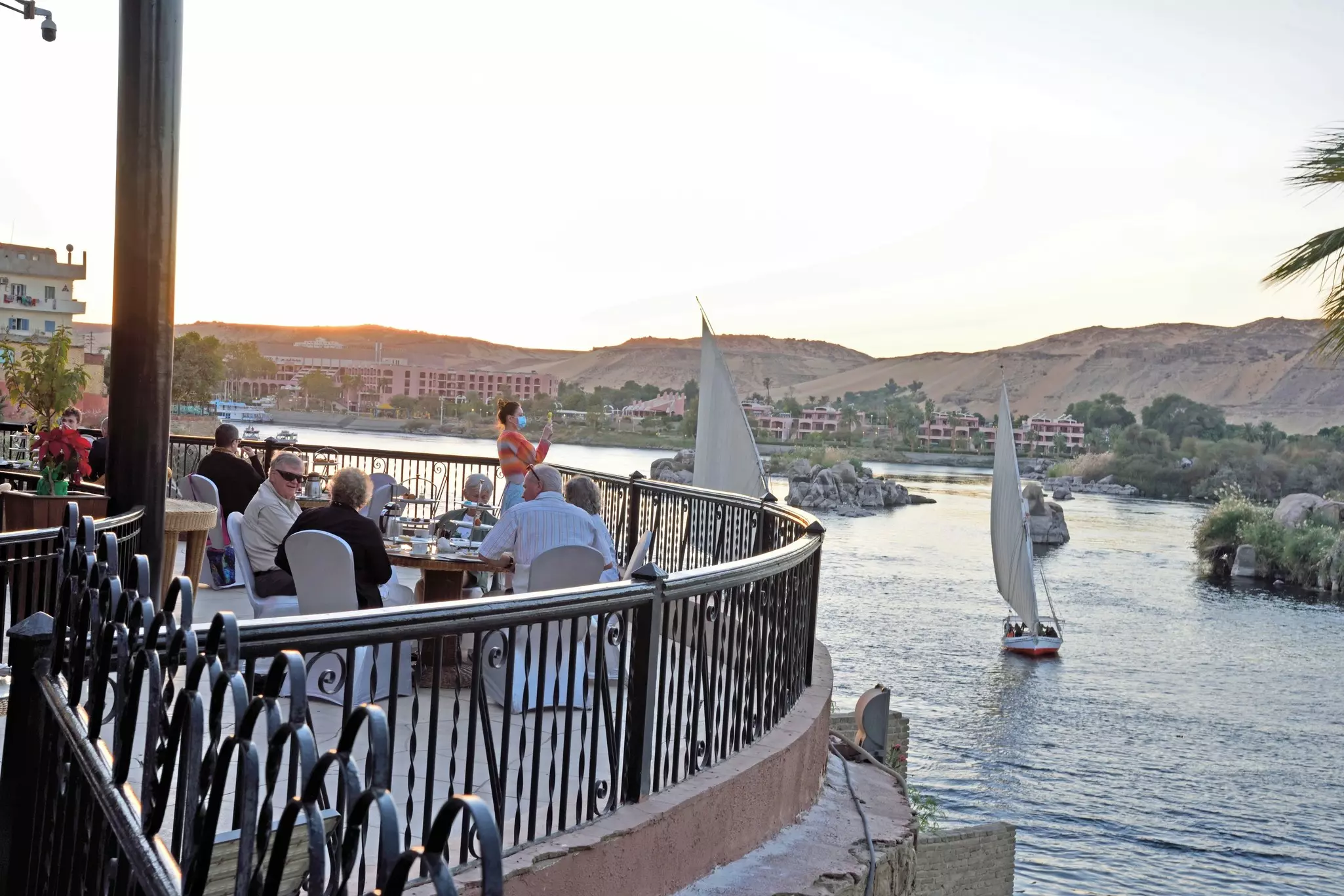 December 23, 2021, Aswan, Egypt.  Visitors Enjoying High Tea at the Famous Cataract Hotel Overlooking the Nile River., License Type: media, Download Time: 2026-03-15T18:48:14.000Z, User: bhealy950, Editorial: true, purchase_order: 65050 - Digital Destinations and Articles, job: Lonely Planet Online Editorial, client: Best things to do in Aswan, other: Brian Healy